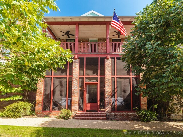 31 Park St, Carlton Landing, OK 74432 - rear view of property featuring brick siding, ceiling fan, and a balcony