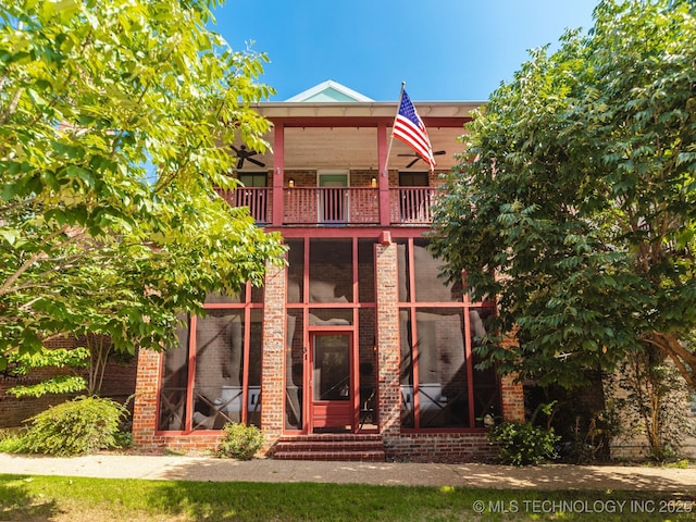 31 Park St, Carlton Landing, OK 74432 - view of front of house featuring brick siding, a balcony, and entry steps