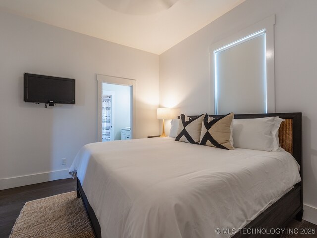 31 Park St, Carlton Landing, OK 74432 - bedroom featuring baseboards and dark wood-style flooring