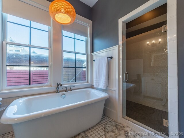 31 Park St, Carlton Landing, OK 74432 - bathroom featuring a shower stall, a freestanding tub, and tile patterned floors