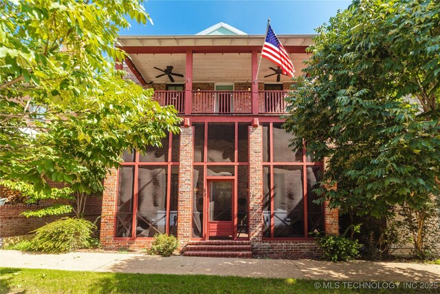 31 Park St, Carlton Landing, OK 74432 - back of house featuring brick siding, a ceiling fan, and a balcony