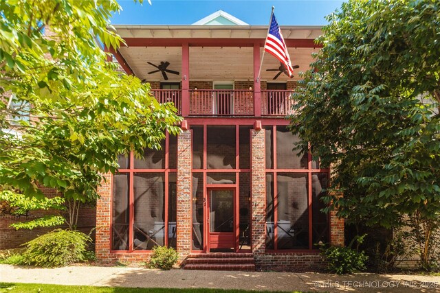 31 Park St, Carlton Landing, OK 74432 - exterior space featuring brick siding, a ceiling fan, and a balcony