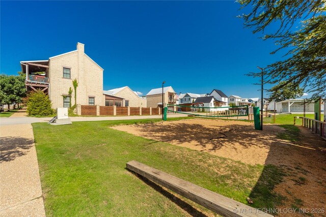 31 Park St, Carlton Landing, OK 74432 - view of property's community featuring volleyball court, fence, a yard, and a residential view