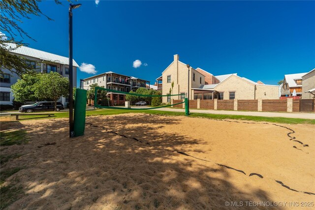 31 Park St, Carlton Landing, OK 74432 - view of home's community with a residential view, volleyball court, and fence