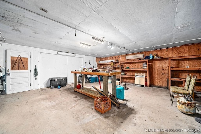 garage with a workshop area