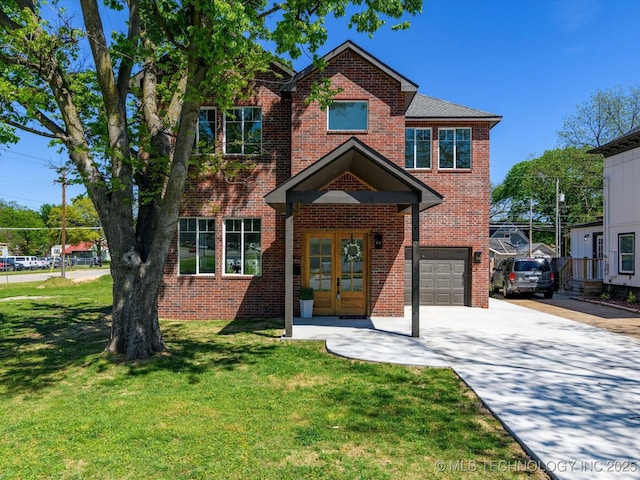 traditional-style home with french doors, a front lawn, concrete driveway, a garage, and brick siding
