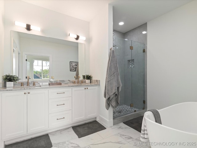 full bath with marble finish floor, a sink, double vanity, and a stall shower