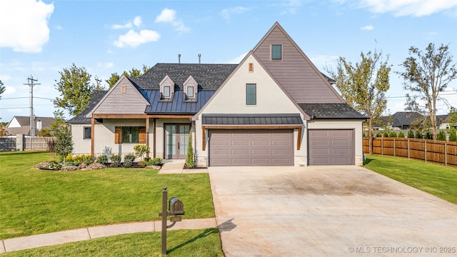 view of front of house featuring a garage, driveway, fence, metal roof, and a standing seam roof
