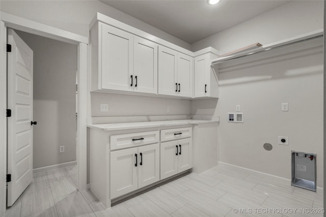 clothes washing area with recessed lighting, hookup for an electric dryer, baseboards, cabinet space, and washer hookup
