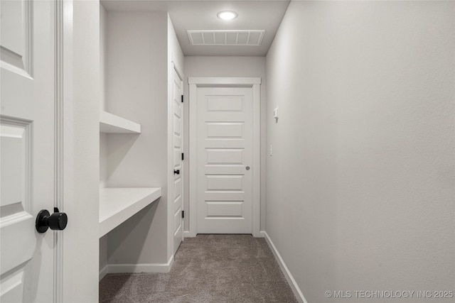 doorway to outside featuring recessed lighting, carpet floors, visible vents, and baseboards