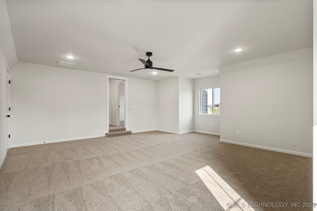 unfurnished room featuring recessed lighting, carpet floors, a ceiling fan, and baseboards