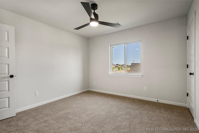 empty room with baseboards, carpet floors, and ceiling fan