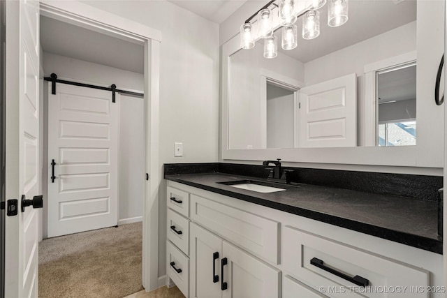 bathroom featuring baseboards and vanity