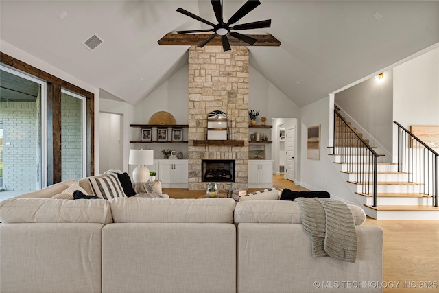 13676 S 23rd St, Bixby, OK 74008 - living room with ceiling fan, wood finished floors, stairway, high vaulted ceiling, and a fireplace