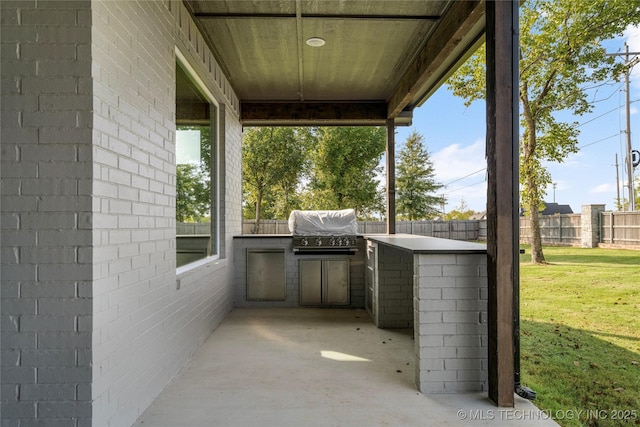 13676 S 23rd St, Bixby, OK 74008 - fenced backyard with an outdoor kitchen and a patio area