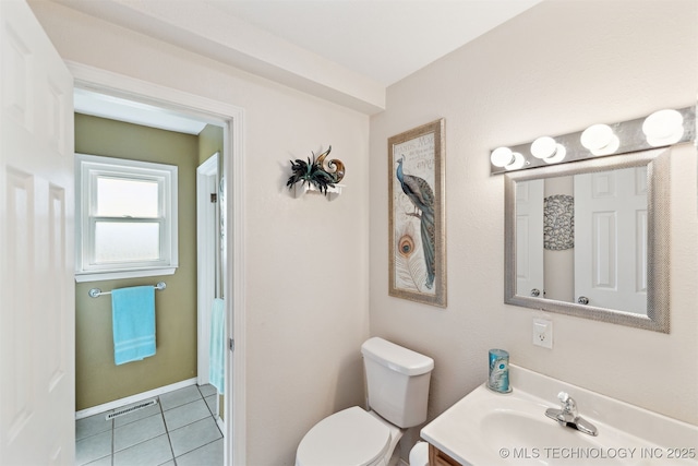904 N Morningside Dr, Vinita, OK 74301 - bathroom with visible vents, vanity, tile patterned flooring, and toilet