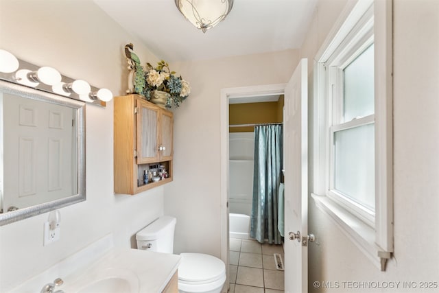 904 N Morningside Dr, Vinita, OK 74301 - bathroom with vanity, a wealth of natural light, toilet, tile patterned flooring, and shower / bath combo with shower curtain