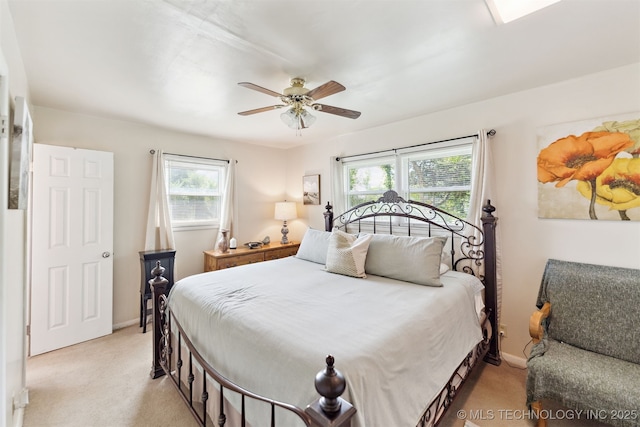 904 N Morningside Dr, Vinita, OK 74301 - bedroom with light colored carpet, baseboards, and multiple windows