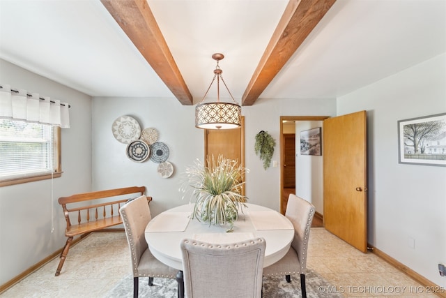 904 N Morningside Dr, Vinita, OK 74301 - dining area with baseboards, beam ceiling, and light tile patterned floors
