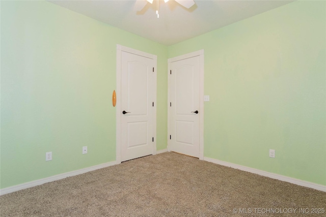 2202 Sycamore Rd, Mcalester, OK 74501 - empty room featuring carpet floors, a ceiling fan, and baseboards