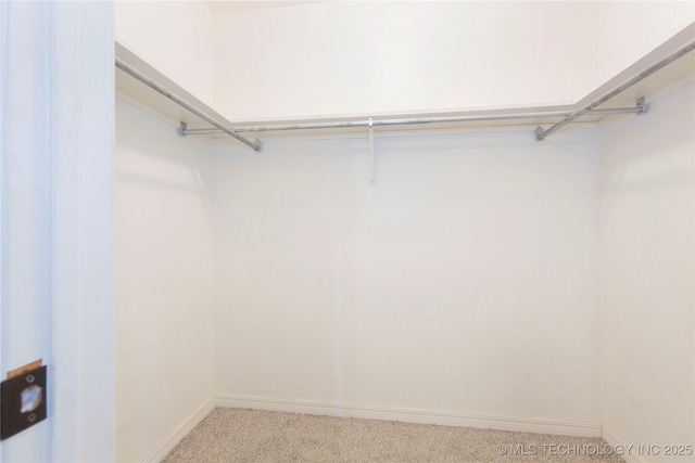 2202 Sycamore Rd, Mcalester, OK 74501 - walk in closet featuring carpet