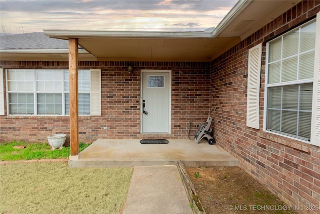 2202 Sycamore Rd, Mcalester, OK 74501 - doorway to property with a patio area and brick siding