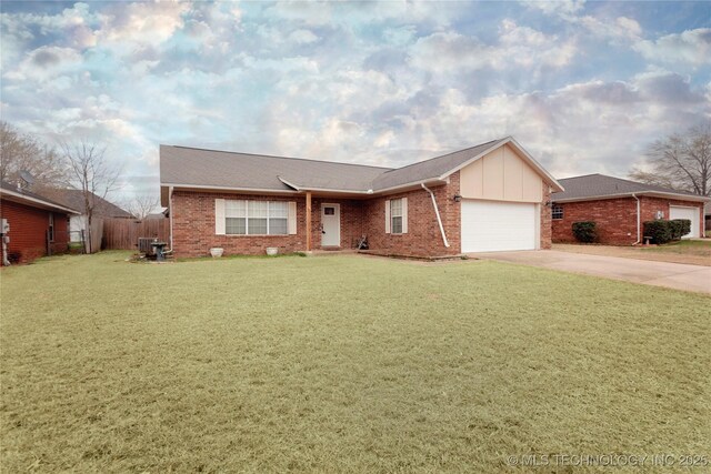 2202 Sycamore Rd, Mcalester, OK 74501 - ranch-style home featuring a front lawn, concrete driveway, fence, a garage, and brick siding