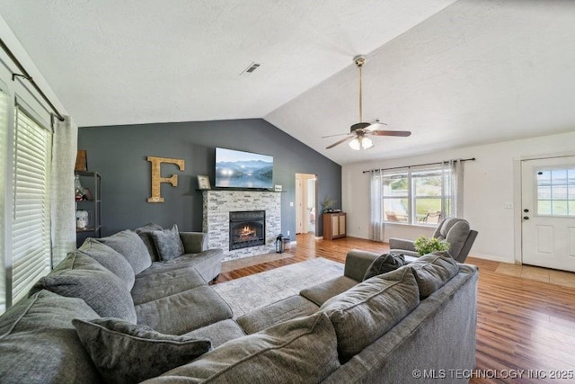 35041 Cohea Ln, Ketchum, OK 74331 - living area with vaulted ceiling, visible vents, light wood finished floors, and a ceiling fan