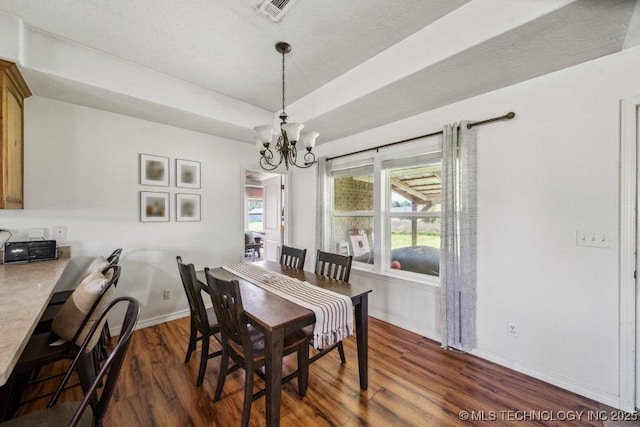 35041 Cohea Ln, Ketchum, OK 74331 - dining area with dark wood-style floors, a tray ceiling, visible vents, baseboards, and a notable chandelier