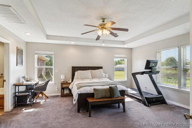 35041 Cohea Ln, Ketchum, OK 74331 - carpeted bedroom with a textured ceiling, a raised ceiling, visible vents, and baseboards