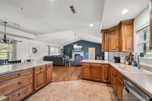 35041 Cohea Ln, Ketchum, OK 74331 - kitchen featuring stainless steel dishwasher, visible vents, a sink, and a fireplace