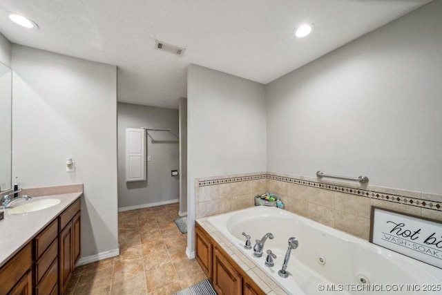 35041 Cohea Ln, Ketchum, OK 74331 - bathroom with recessed lighting, a whirlpool tub, visible vents, and vanity