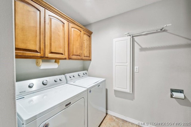 35041 Cohea Ln, Ketchum, OK 74331 - clothes washing area with washing machine and clothes dryer, baseboards, light tile patterned flooring, and cabinet space