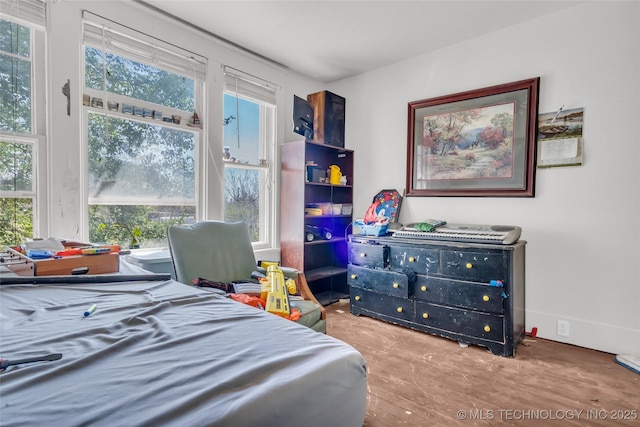 bedroom with wood finished floors