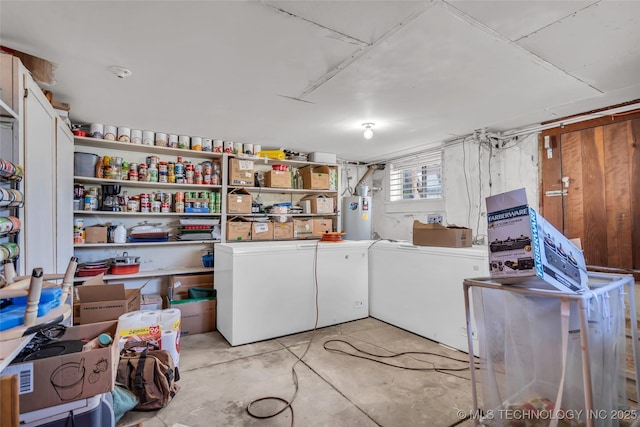 laundry room with separate washer and dryer, water heater, and laundry area