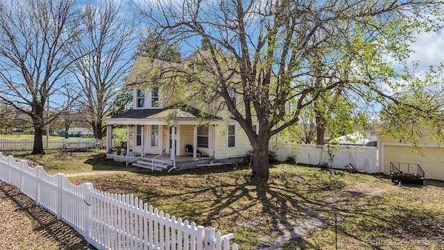 exterior space featuring a fenced backyard and covered porch