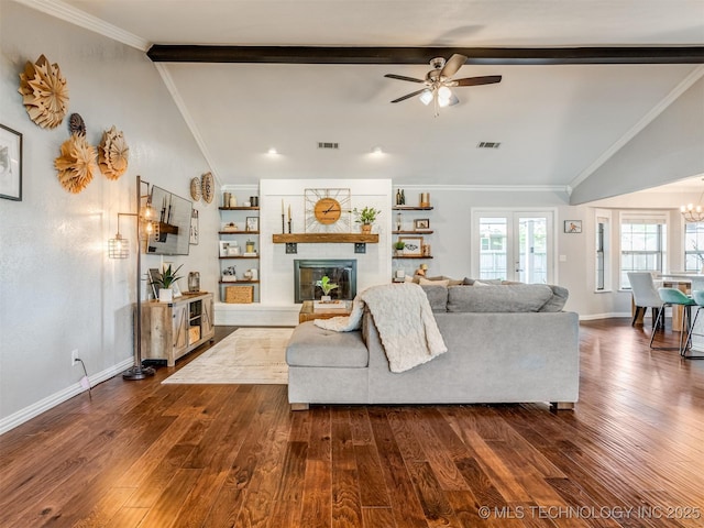 living area featuring a fireplace, visible vents, and lofted ceiling with beams