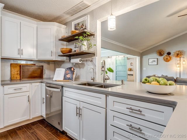 kitchen featuring stainless steel dishwasher, ornamental molding, dark wood-style flooring, a sink, and visible vents