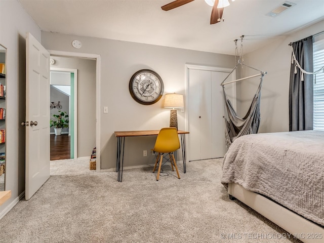 bedroom with visible vents, ceiling fan, carpet floors, and baseboards