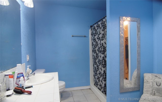 705 S Garfield Ave, Wagoner, OK 74467 - full bathroom with tile patterned floors, a shower with shower curtain, toilet, and vanity