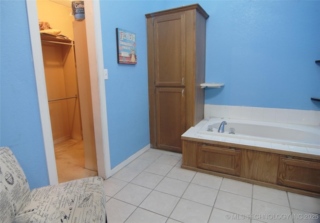 705 S Garfield Ave, Wagoner, OK 74467 - full bath with a bath, tile patterned flooring, and baseboards