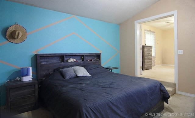 705 S Garfield Ave, Wagoner, OK 74467 - carpeted bedroom featuring baseboards