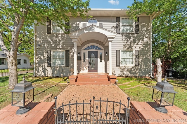 view of front of house featuring a gate and a fenced front yard