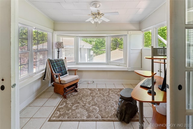 sunroom / solarium with tile patterned floors, baseboards, and ornamental molding