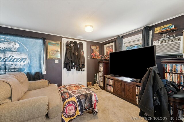 living area with crown molding and carpet flooring