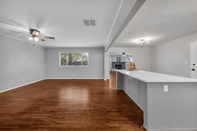 507 W Quincy St, Broken Arrow, OK 74012 - kitchen featuring open floor plan, ceiling fan, baseboards, dark wood-style flooring, and gray cabinetry