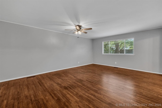 507 W Quincy St, Broken Arrow, OK 74012 - spare room featuring ceiling fan, baseboards, crown molding, and dark wood finished floors