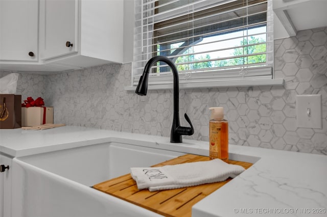 507 W Quincy St, Broken Arrow, OK 74012 - kitchen view of white cabinets, tasteful backsplash, and a sink