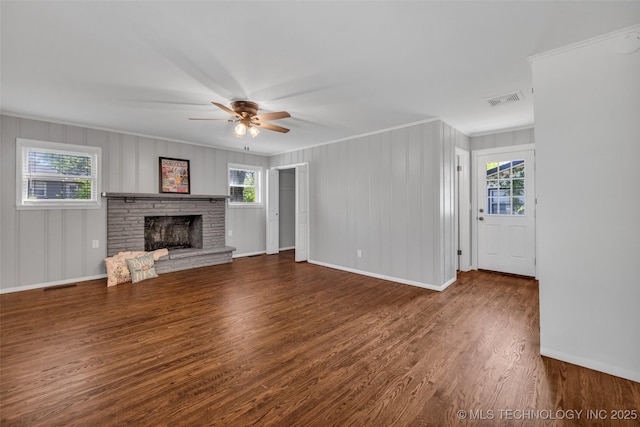 507 W Quincy St, Broken Arrow, OK 74012 - unfurnished living room with ornamental molding, wood finished floors, baseboards, a ceiling fan, and a brick fireplace