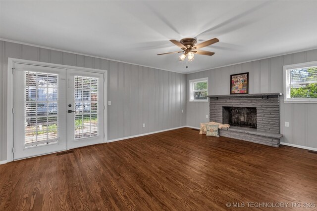 507 W Quincy St, Broken Arrow, OK 74012 - unfurnished living room with a stone fireplace, ceiling fan, wood finished floors, healthy amount of natural light, and ornamental molding